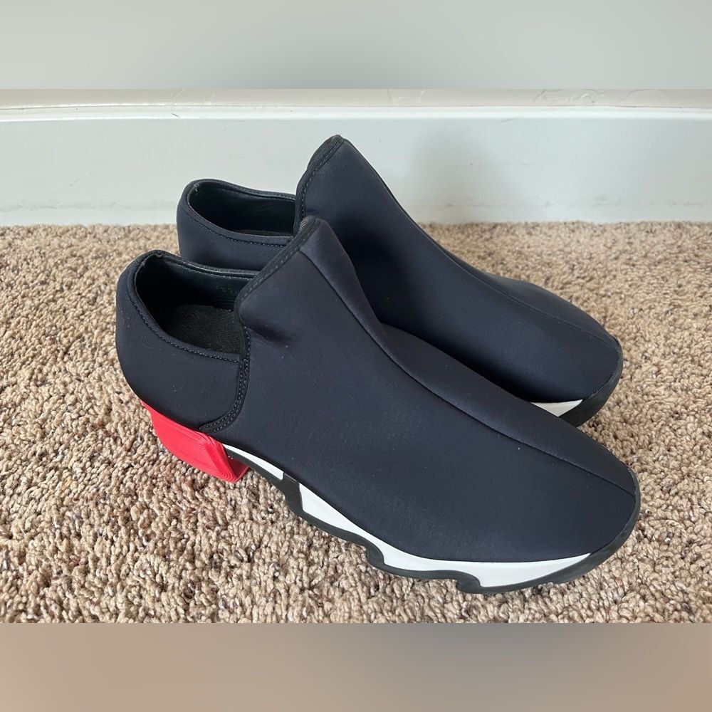 Women’s Black Slip-On Fashion Sneakers with Red Heel Accent